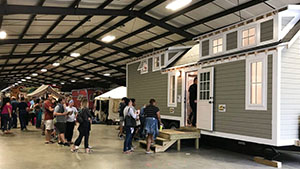 people line up to see tiny house